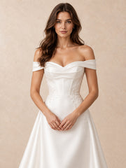 Off-the-Shoulder Satin Wedding Dress with Pearl Accents and Embroidered Appliqués